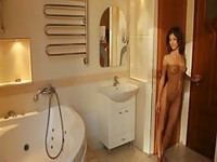 Solo newcomer that just turned eighteen exposes her natural breasts and tight pussy showers in her debut