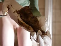 Scat babe collecting her nasty poop in a glove
