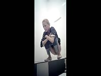 Blonde babe shitting with pants on