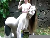 Girl milking a MILF's big boobs