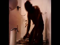Man bathes herself with a bucket of poop